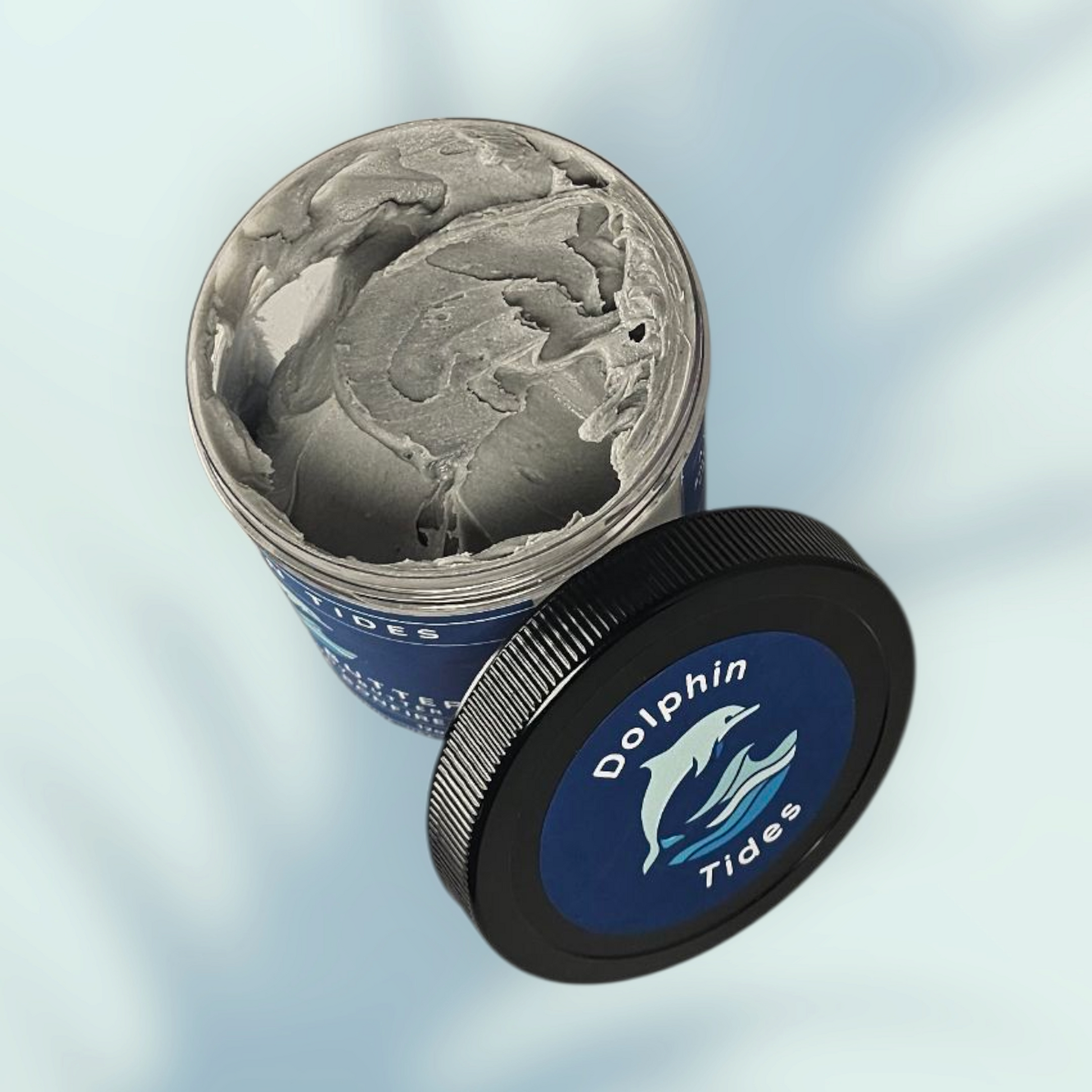 Container of 'Dolphin Tides' product with a blue label on a light gray background