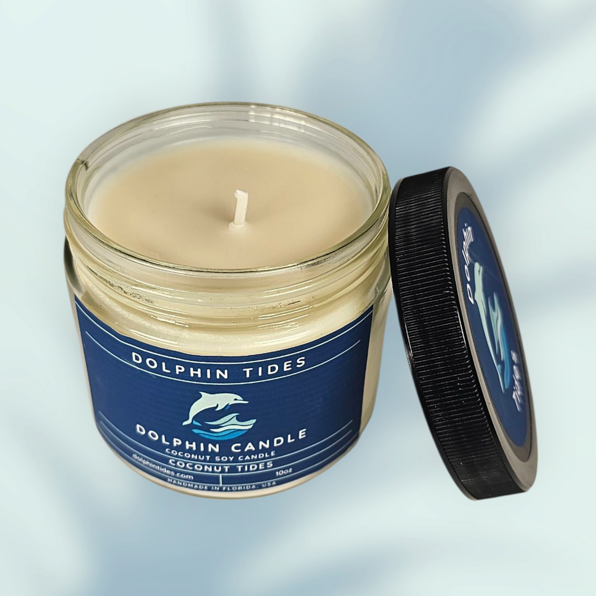 Candle in a jar with a blue label on a light gray background